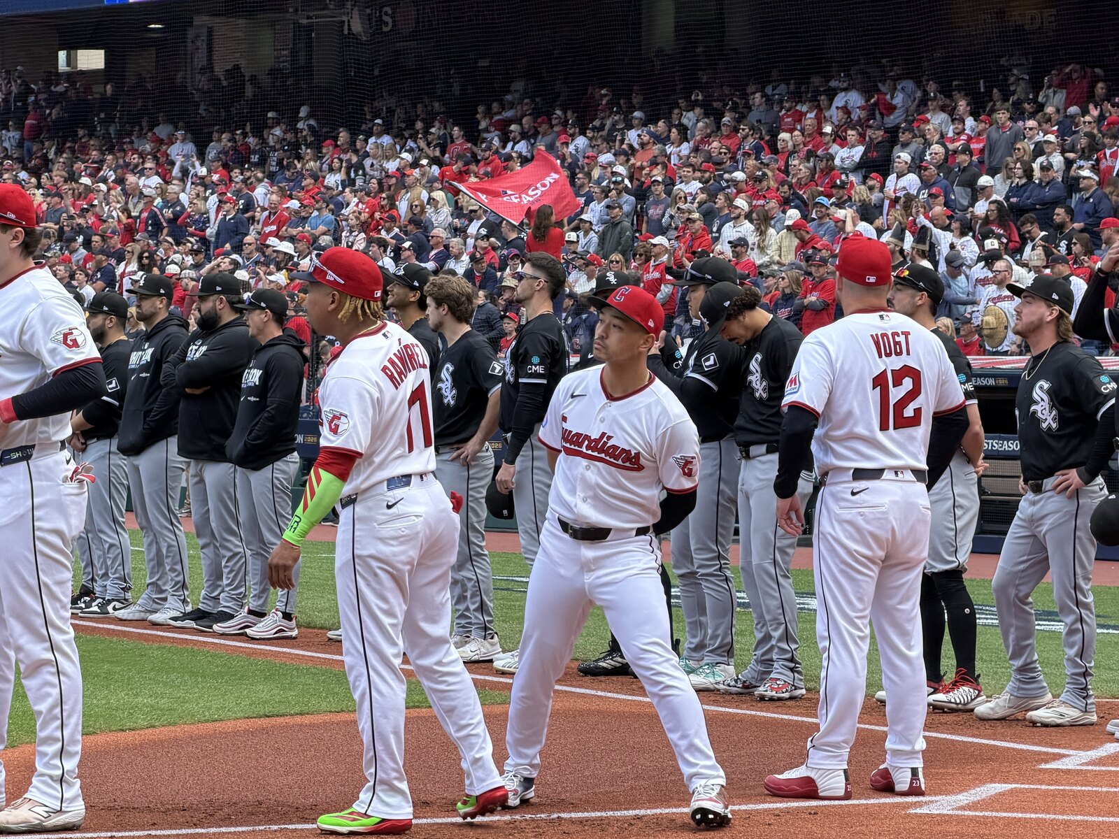 Cleveland Guardians and Chicago White Sox players line up at Progressive Field before Game 1 of the 2026 ALDS