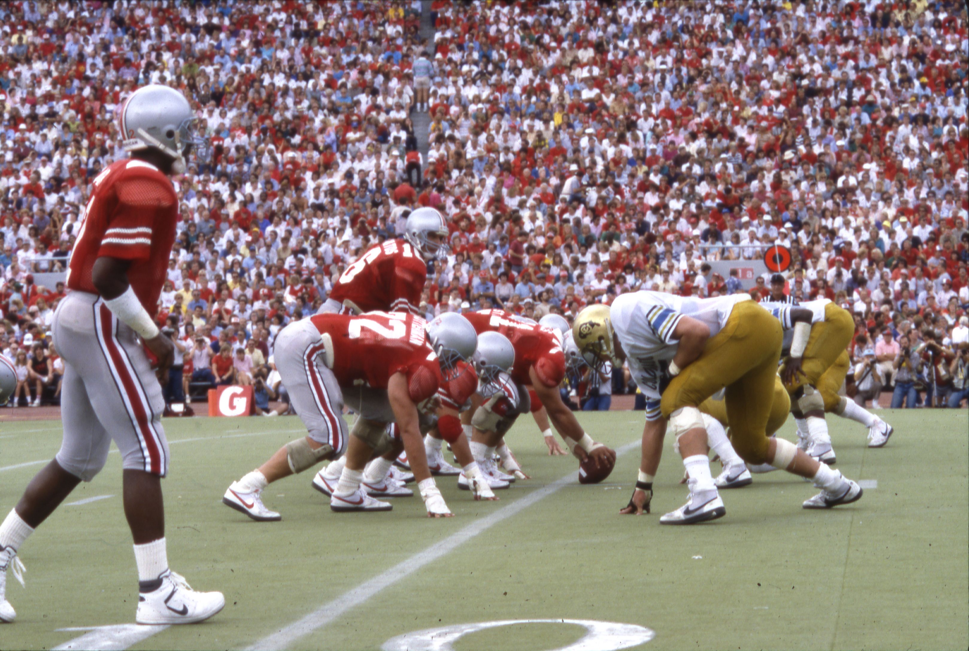 Ohio State quarterback Jim Karsatos surveying Colorado's defense at the line of scrimmage in 1986