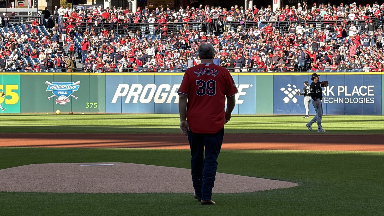 Len Barker wearing his number 39 jersey near the mound at Progressive Field before his ceremonial first pitch ahead of ALDS Game 2